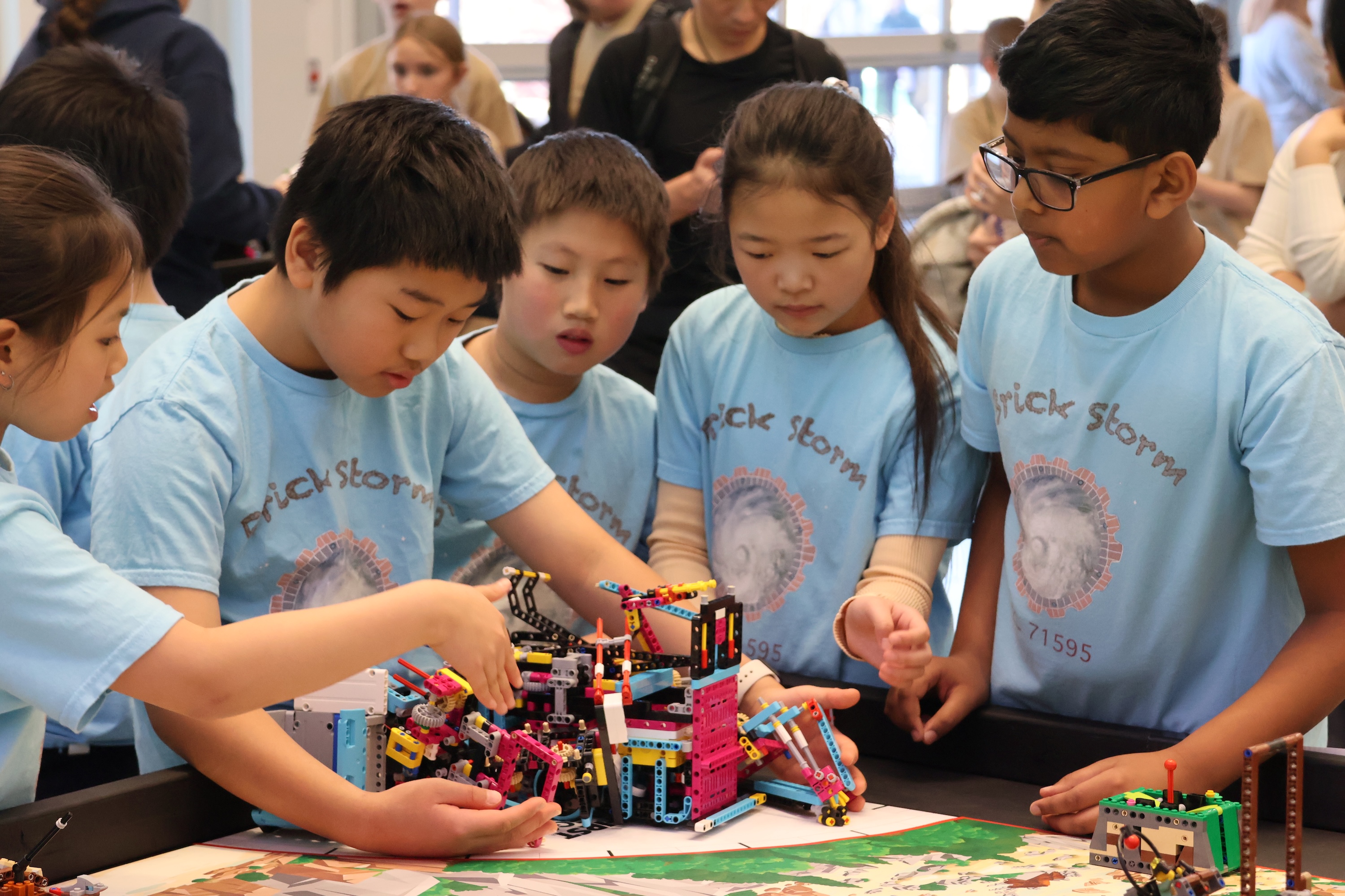 Students participating in FIRST Lego League Challenge tournament